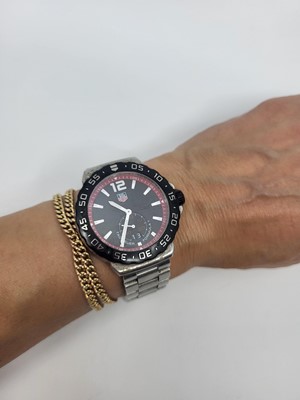 Lot 449 - A GENT'S TAG HEUER WRIST WATCH, black dial...
