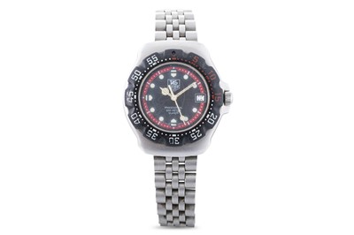 Lot 450 - A TAG HEUER WRIST WATCH, black dial with date,...