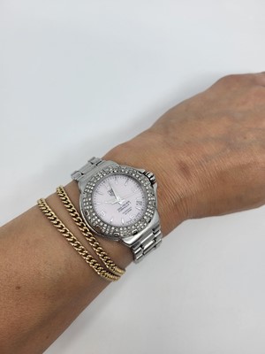 Lot 451 - A TAG HEUER FORMULA 1 WRIST WATCH, pink mother...