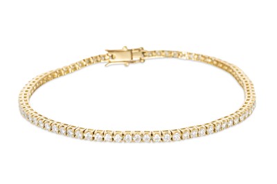 Lot 213 - A DIAMOND LINE BRACELET, the brilliant cut...