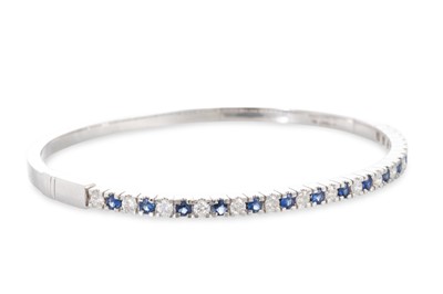 Lot 288 - A SAPPHIRE AND DIAMOND BANGLE, the circular...