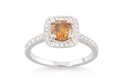 Lot 291 - A FANCY ORANGE COLOURED DIAMOND CLUSTER RING,...