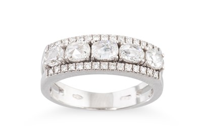 Lot 293 - A THREE ROWED DIAMOND RING, the central row of...
