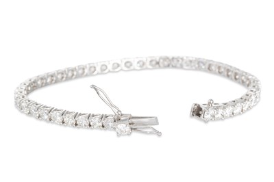 Lot 397 - A DIAMOND LINE BRACELET, the brilliant cut...