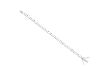 Lot 397 - A DIAMOND LINE BRACELET, the brilliant cut...