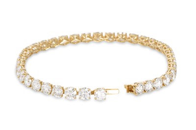 Lot 401 - A DIAMOND LINE BRACELET, the brilliant cut...