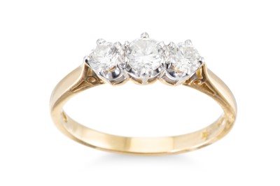 Lot 4 - A DIAMOND THREE STONE RING, the round...