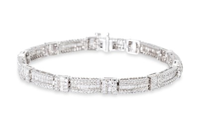Lot 286 - A DIAMOND BRACELET, each rectangular panel set...