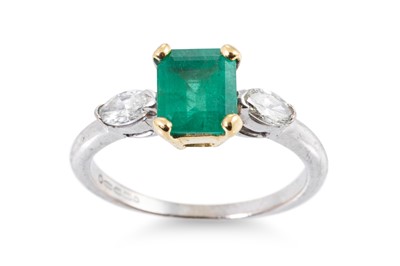 Lot 289 - AN EMERALD AND DIAMOND THREE STONE RING, the...