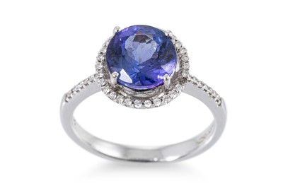 Lot 290 - A TANZANITE AND DIAMOND CLUSTER RING, the...