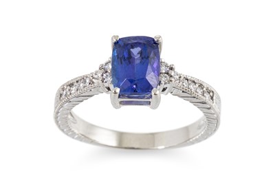Lot 216 - A TANZANITE AND DIAMOND RING, the oval...