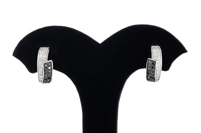 Lot 299 - A PAIR OF PAVÉ SET BLACK AND WHITE DIAMOND...