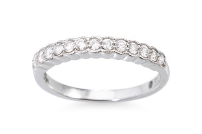 Lot 256 - A DIAMOND HALF ETERNITY RING, with millegrain...