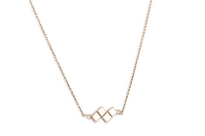 Lot 2 - A 9CT YELLOW GOLD PENDANT and chain, the...