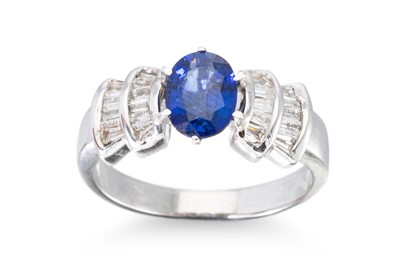 Lot 315 - A SAPPHIRE AND DIAMOND RING, the oval sapphire...