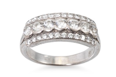 Lot 265 - A THREE ROWED DIAMOND RING, the brilliant cut...