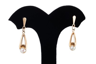Lot 122 - A PAIR OF PEARL SET DROP EARRINGS, mounted in...