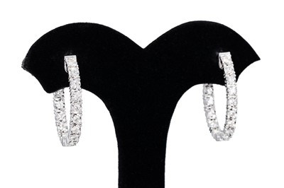 Lot 143 - A PAIR OF DIAMOND SET HOOP EARRINGS, mounted...