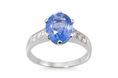 Lot 213 - A SAPPHIRE AND DIAMOND RING, the oval sapphire...