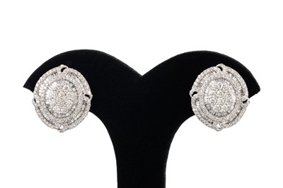 Lot 215 - A PAIR OF DIAMOND CLUSTER EARRINGS, set with...