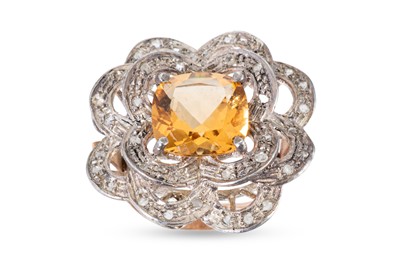 Lot 243 - A CITRINE DRESS RING, the cushion cut stone to...