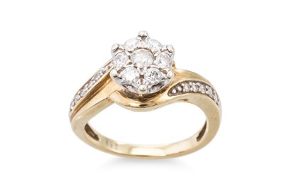 Lot 222 - A DIAMOND CLUSTER DRESS RING, with cross over...