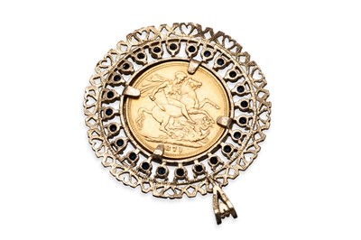 Lot 343 - AN 1871 FULL GOLD SOVEREIGN COIN, in a fancy...