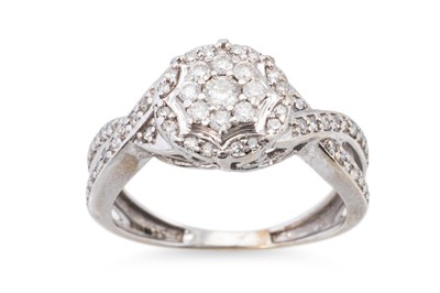 Lot 234 - A DIAMOND CLUSTER RING, the round cut diamonds...