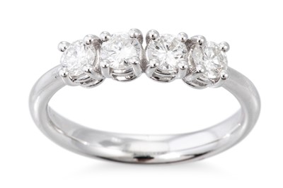 Lot 59 - A DIAMOND FOUR STONE RING, the four round...