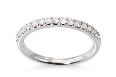 Lot 60 - A DIAMOND HALF ETERNITY RING, the round...