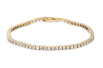 Lot 192 - A DIAMOND LINE BRACELET, the round brilliant...