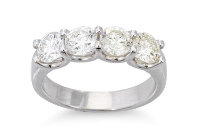Lot 281 - A DIAMOND FOUR STONE RING, the round brilliant...