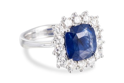 Lot 325 - A SAPPHIRE AND DIAMOND CLUSTER RING, the...