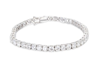 Lot 326 - A DIAMOND LINE BRACELET, the round brilliant...