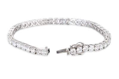 Lot 326 - A DIAMOND LINE BRACELET, the round brilliant...