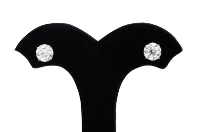 Lot 328 - A PAIR OF DIAMOND STUD EARRINGS, the round...