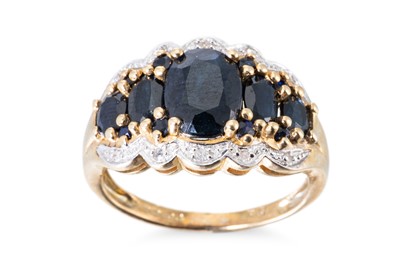 Lot 13 - A DIAMOND AND SAPPHIRE CLUSTER RING, the...