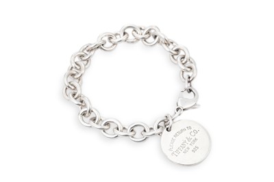 Lot 15 - A TIFFANY & CO SILVER BRACELET, with return to...