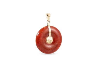 Lot 17 - A STONESET PENDANT, the cabachon donut...