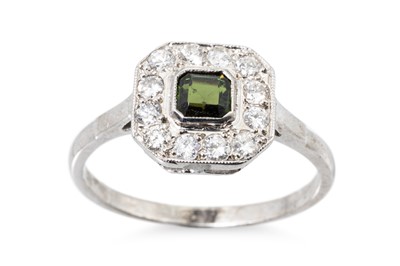 Lot 21 - A GEMSTONE AND DIAMOND CLUSTER RING, to...