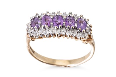 Lot 32 - A DIAMOND AND AMETHYST CLUSTER RING, the oval...