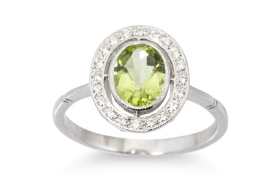 Lot 37 - A PERIDOT AND DIAMOND CLUSTER RING, the...