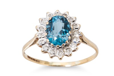 Lot 130 - A DIAMOND AND TOPAZ CLUSTER RING, the oval...