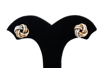 Lot 133 - A PAIR OF THREE COLOUR GOLD KNOT EARRINGS,...