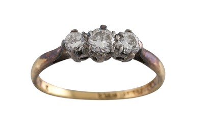 Lot 84 - A VINTAGE DIAMOND THREE STONE RING, the...