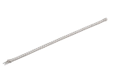 Lot 193 - A DIAMOND LINE BRACELET, the brilliant cut...