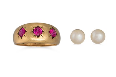 Lot 2 - A THREE STONE RUBY RING, mounted in 9ct gold;...