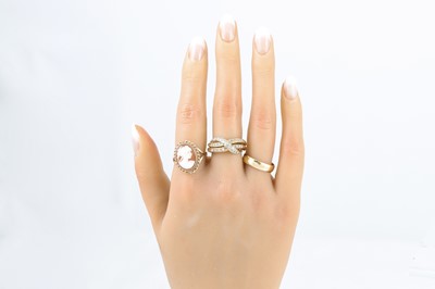 Lot 44 - THREE GOLD RINGS, one set with a cameo, 14.5 g,...