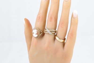Lot 44 - THREE GOLD RINGS, one set with a cameo, 14.5 g,...