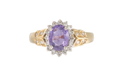 Lot 18 - A DIAMOND AND PURPLE SAPPHIRE CLUSTER RING,...